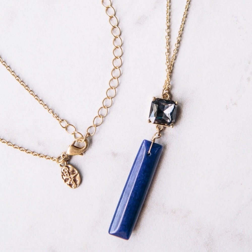 Long blue crystal and bar pendent.